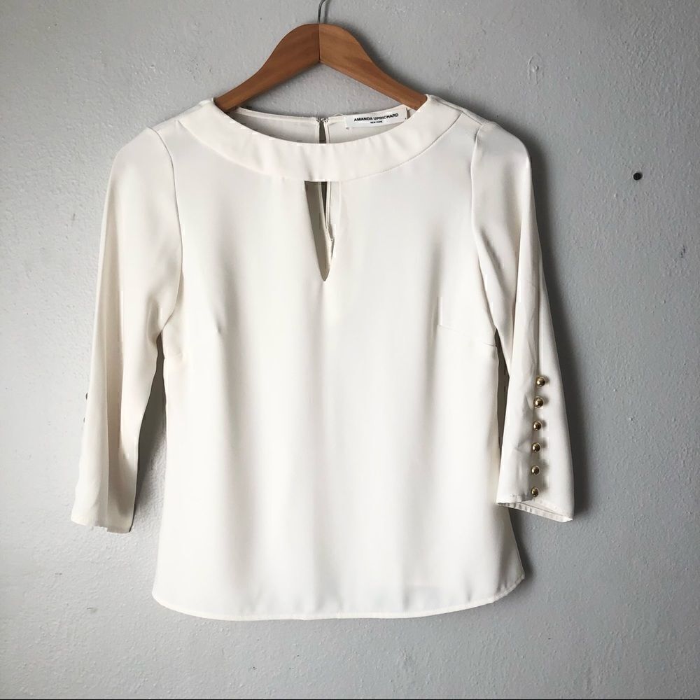 Amanda Uprichard cream colored blouse with gold button sleeves size small